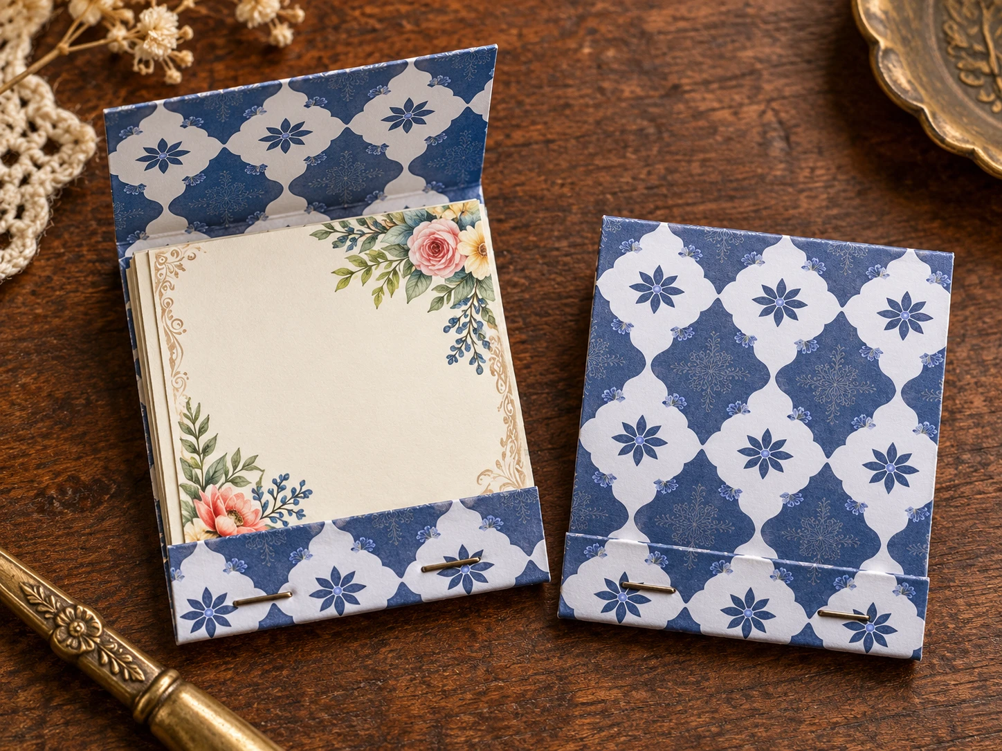 Open and closed blue-and-white matchbook journals, with two staples securing the lower lip.